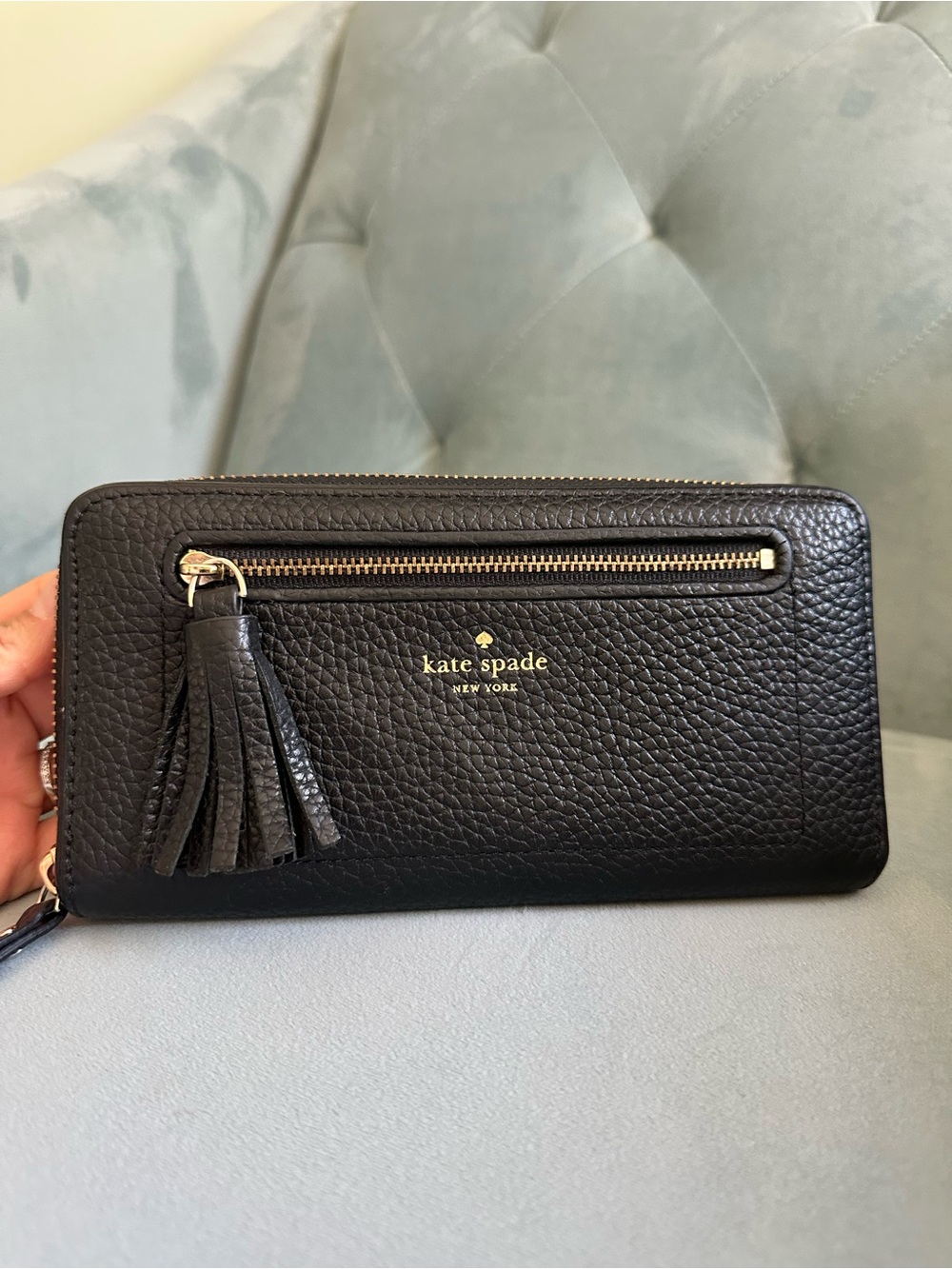 kate spade black pebbled leather zip-around wallet with tassel